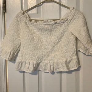 Smocked off the shoulder is white top